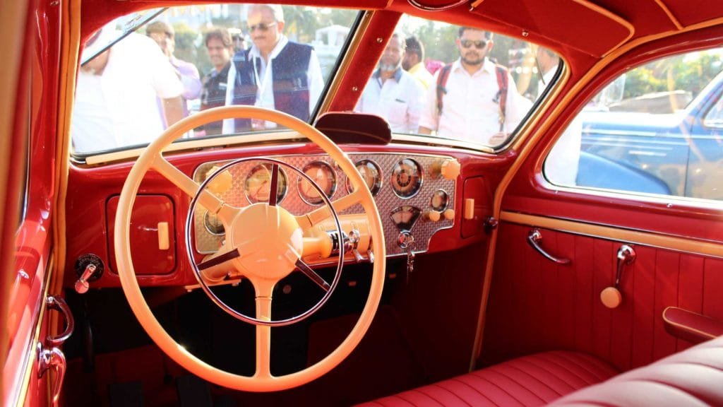 An ornate engine-turned dashboard with a selection of instrumentation inside Cord 810 1936, Photo Credit: Karl Bhote