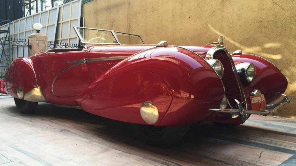 View of Eagle shaped car mascot, radiator grilles, French airplanes and tear drop inspired fenders and silver streamline inspired bands on Delahaye 135MS 1939, Photo Credit: Karl Bhote