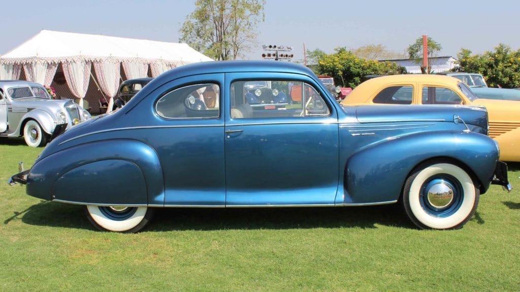 Silver speed lines highlighting the streamline form of the heavily chromed Lincoln Zephyr 1941, Photo Credit: Karl Bhote