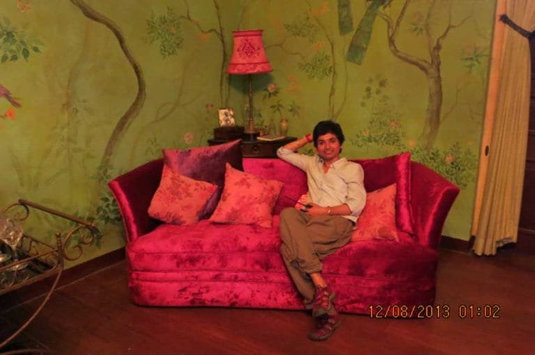 In the midst of a busy shoot at Tissamaharama in Sri Lanka, Sonal poses for the camera on a red velvet Deco sofa used in the film. Photo courtesy: Dhara Jain