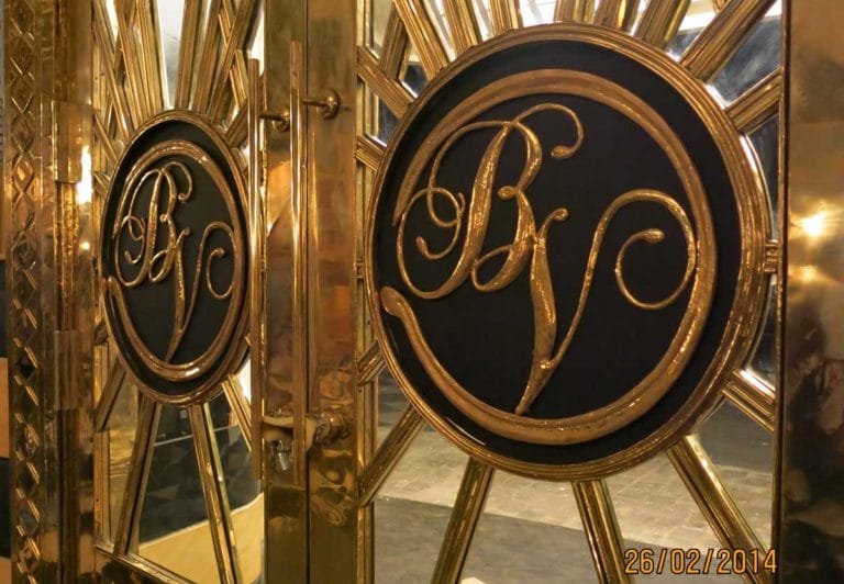 The magnificent entrance doors of the Bombay Velvet Club, made of brass, with the distinctly Deco sunburst motif. Photo courtesy: Dhara Jain