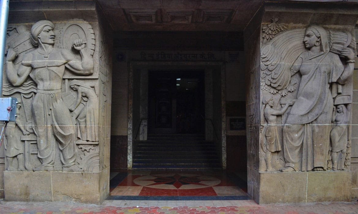 Bas-reliefs flanking the entrance of the New India Assurance Building. Source: Maya Sorabjee