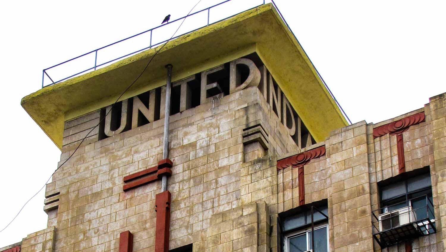 Lettering embedded into the tower of United India Building. Iyengar & Menzies. 1937–1939. Bombay, India. Source: Art Deco Mumbai