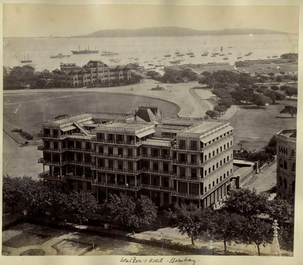 A stunning view of the Watson’s Esplanade hotel with the backdrop of the Maharashtra Police Headquarters on the far left and an open space behind. The hotel was one of the first cast iron-framed structures in India.