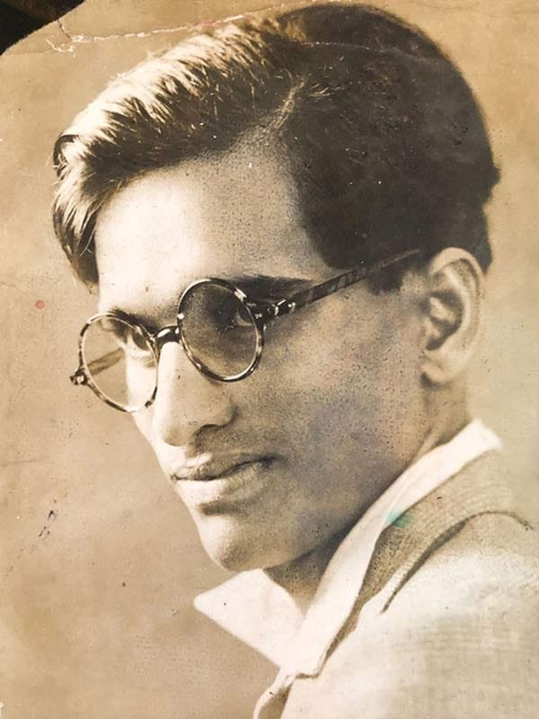 A dapper young Pansare with neatly styled hair and spectacles; Source: Pansare Family Archive