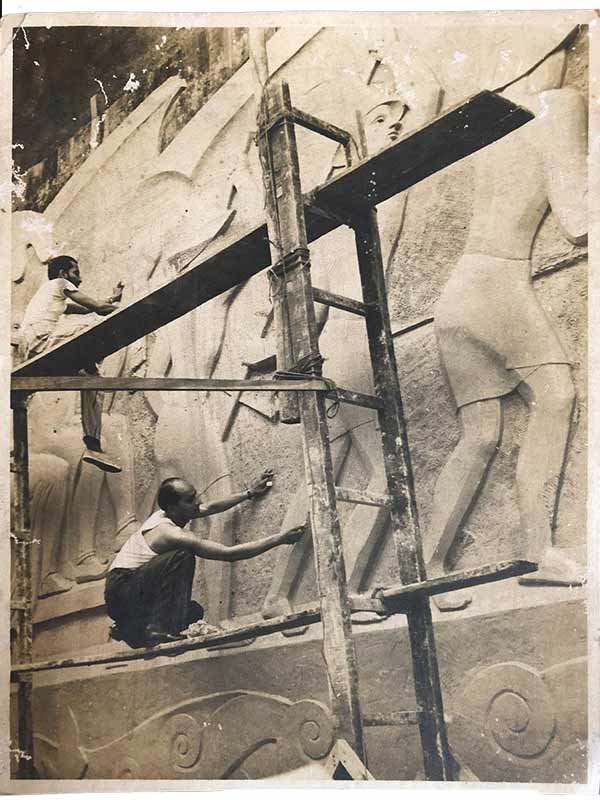 Pansare (wearing dark coloured trousers) working on the reliefs on the Ashoka Hotel in Delhi in the 1950s. The mural he is pictured carving here was 22 feet tall; Source: Pansare Family Archive