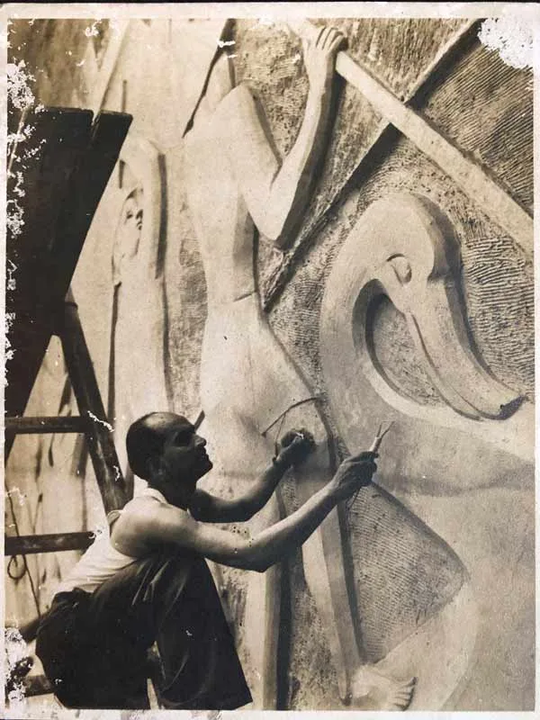 Pansare (wearing dark coloured trousers) working on the reliefs on the Ashoka Hotel in Delhi in the 1950s. The mural he is pictured carving here was 22 feet tall; Source: Pansare Family Archive