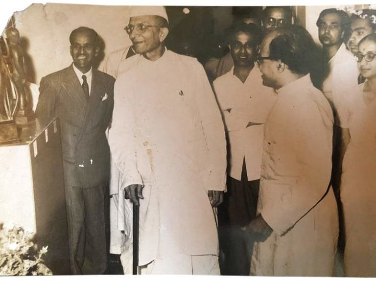 Pansare (on left, wearing dark suit and tie) with the then Chief Minister Morarji Desai and Mr. Kamat (on right, wearing spectacles) on the other side of Desai; Source: Pansare Family Archive