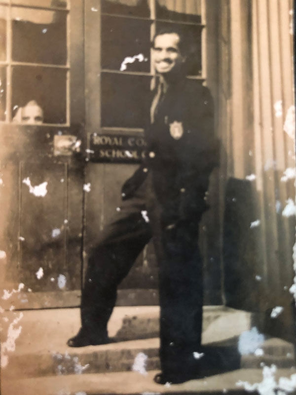 Pansare strikes a confident pose outside the doors of the R.C.A. where he studied from 1938-1940; Source: Pansare Family Archive